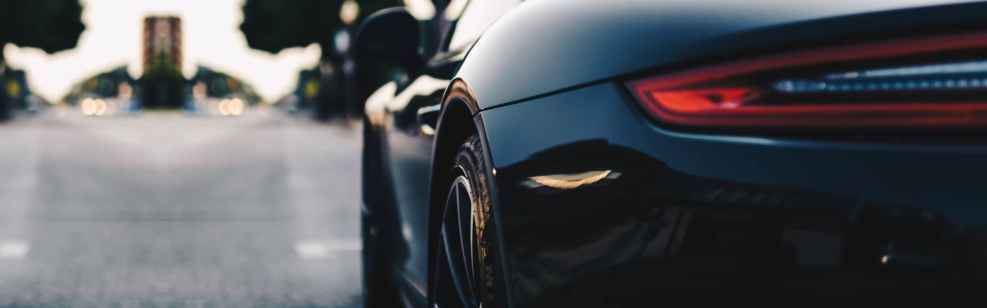 Side View of Car in Street Avada Car Dealership